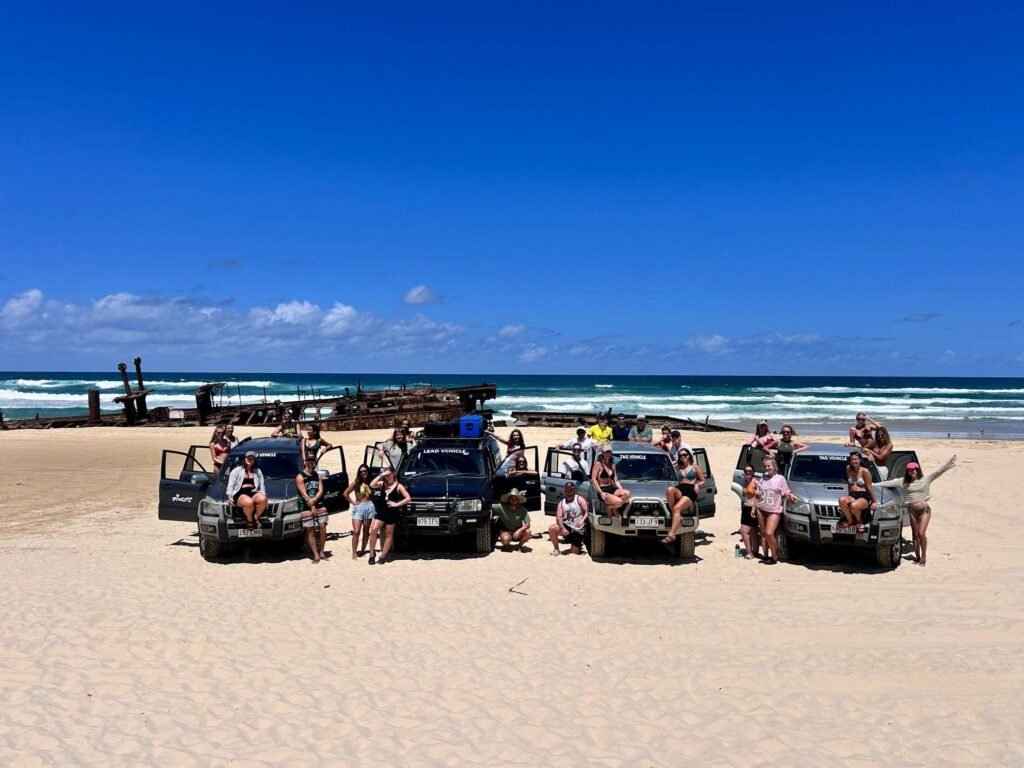 K'gari (Fraser) Island 4WD Tag Along Tour Group pictured on the beach on Fraser Island
