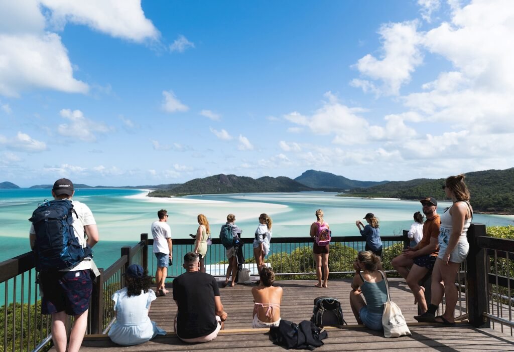Group of people at Hill Inlet Lookout admiring the swirling sands of the Whitsundays