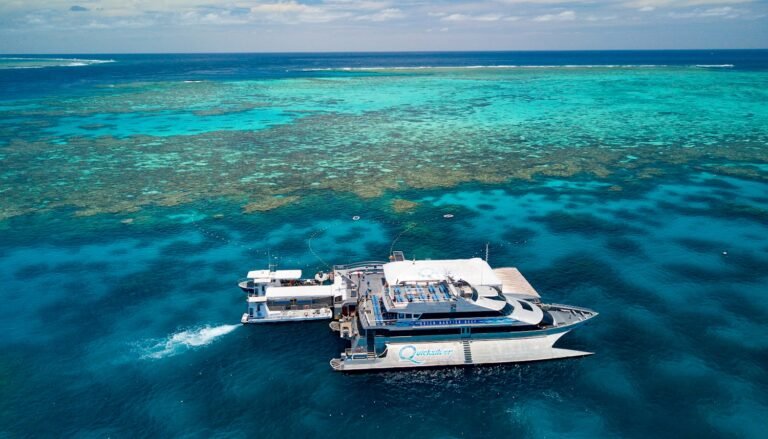 A wide shot of the Quicksilver boat and pontoon out on the Great Barrier Reef.