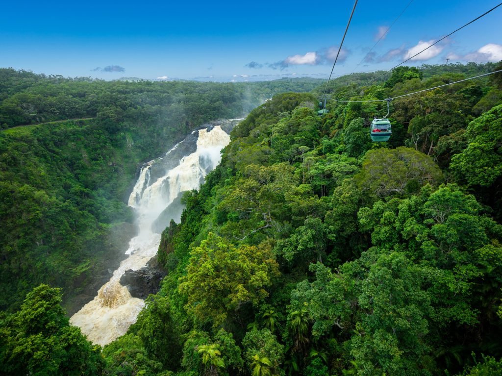 Barron Falls is pictured surrounded by rainforest as a cable car "Sky Rail" makes its way to Kuranda village