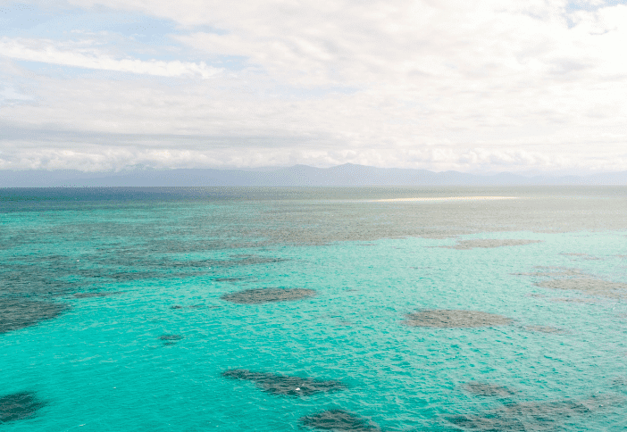Image of a boat on the water on the Great Barrier Reef.