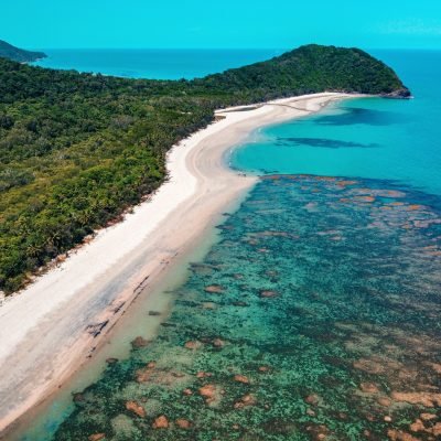 Aerial image of the Great Barrier Reef meeting the Daintree rainforest